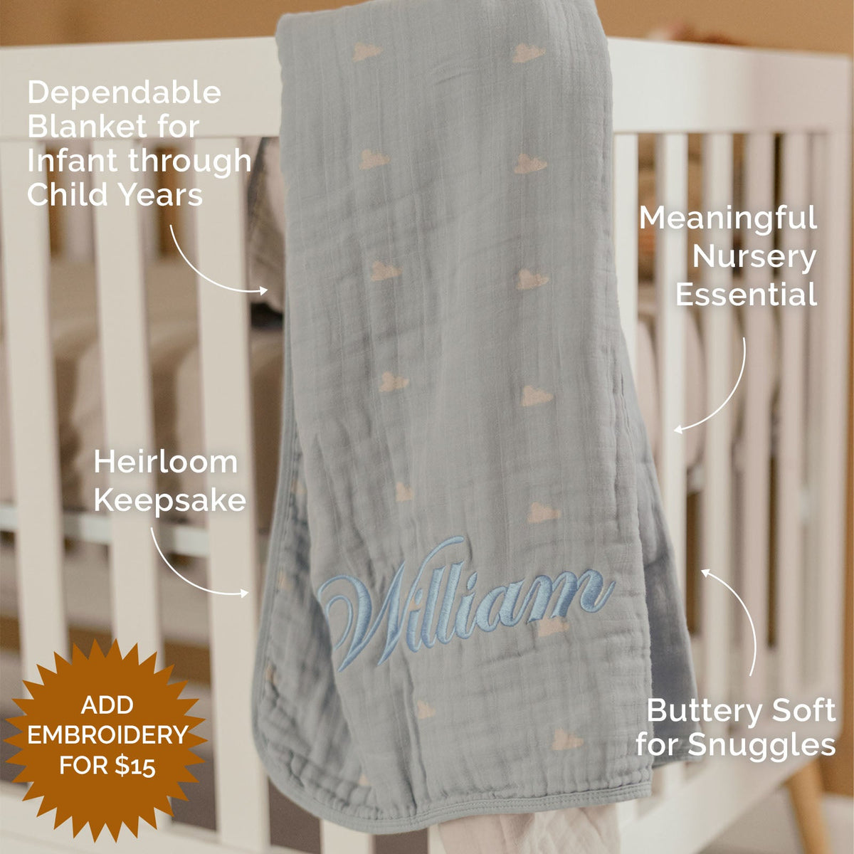 Light gray muslin quilt with small speck motifs and blue embroidered name