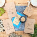 Pet-friendly houseplant seed collection: assorted seed packets and black seed tin lid