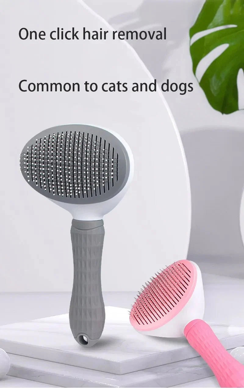 Pet hair removal brush with gray pin plate, shown with a pink spare brush.
