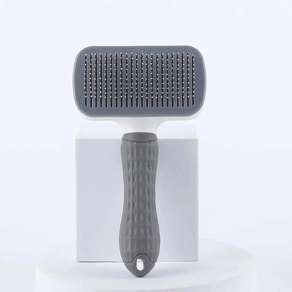 Dark gray pet slicker grooming brush with round comb head and metal pins