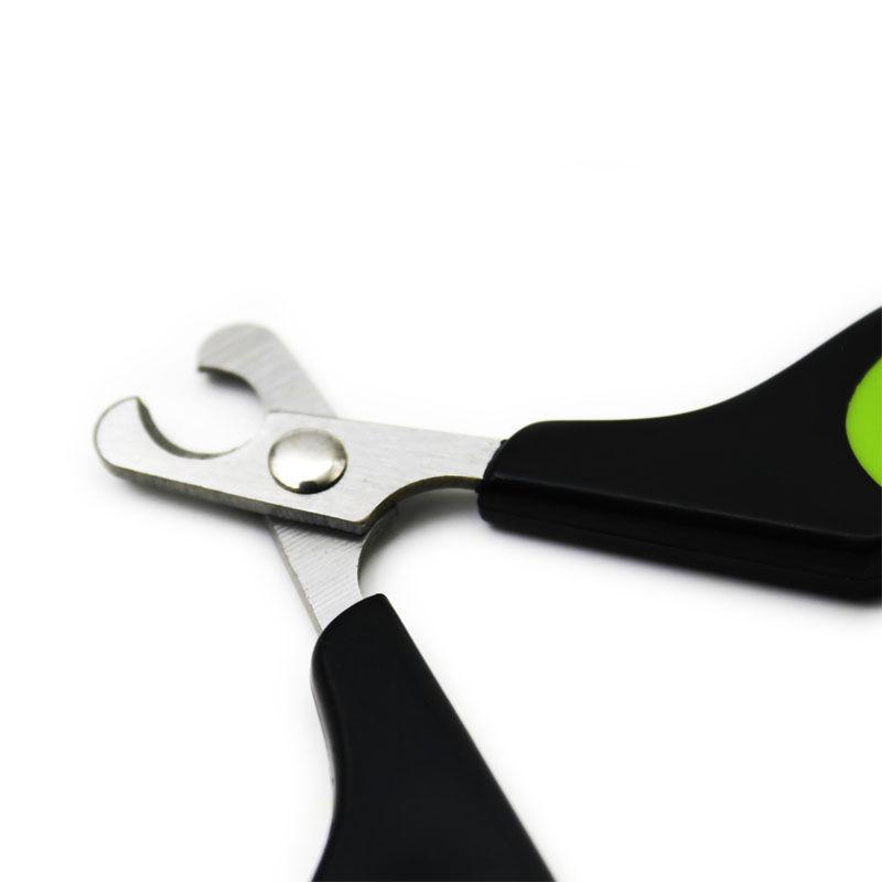 Close-up of the open curved blades and pivot joint on a pet nail clipper