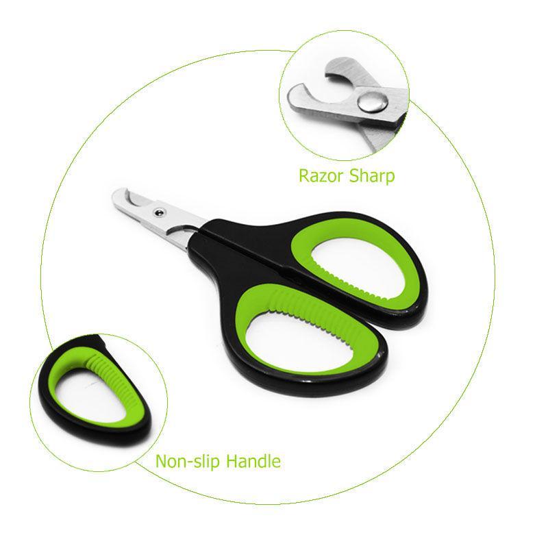 Pet nail clipper with green non-slip handle grips and sharp curved metal blades