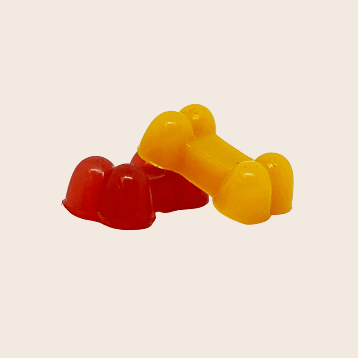 Two colorful shaped pet treats in red and yellow