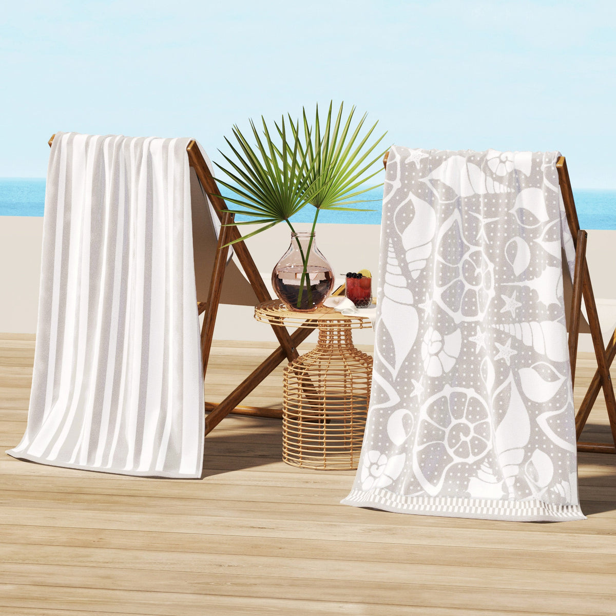 White and gray cotton velour beach towels on wooden beach chairs