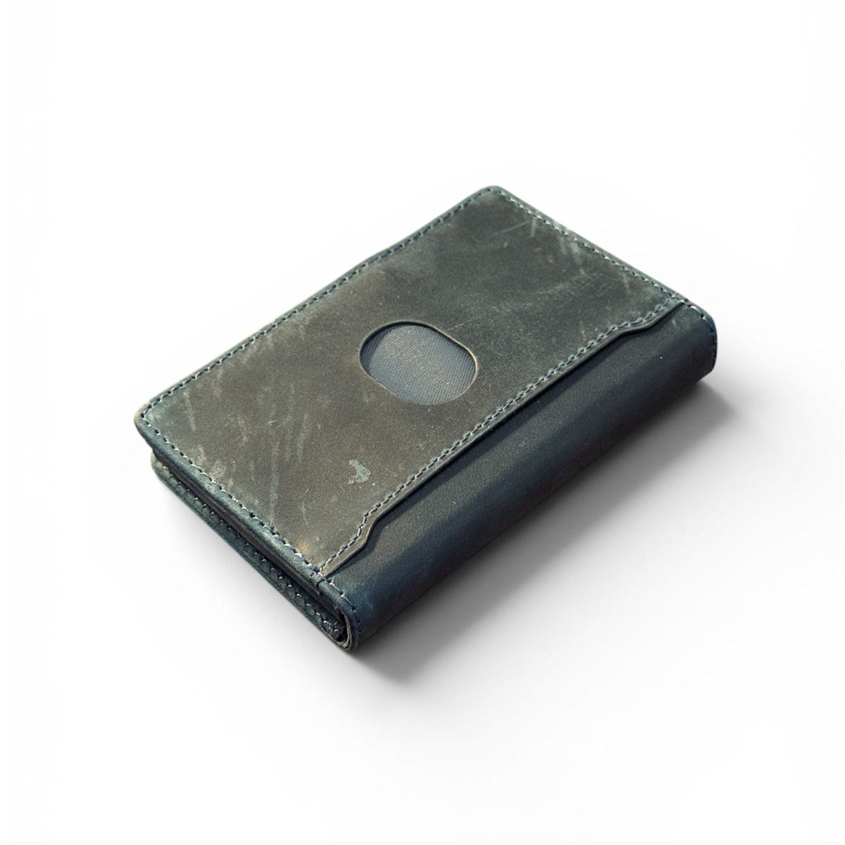 Olive green leather bifold wallet with oval card slot and visible grain