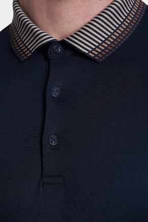 Navy polo placket with three dark buttons and striped contrast point collar