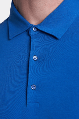 Royal blue polo collar and 3-button placket detail on mercerized knit.