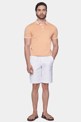 Creamsicle orange mercerized cotton polo shirt with collared neckline and button placket