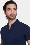 Navy knit polo shirt with three-button placket and collared neckline, short sleeves