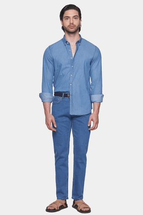 Light blue denim button-up shirt with button-down collar and rolled sleeves