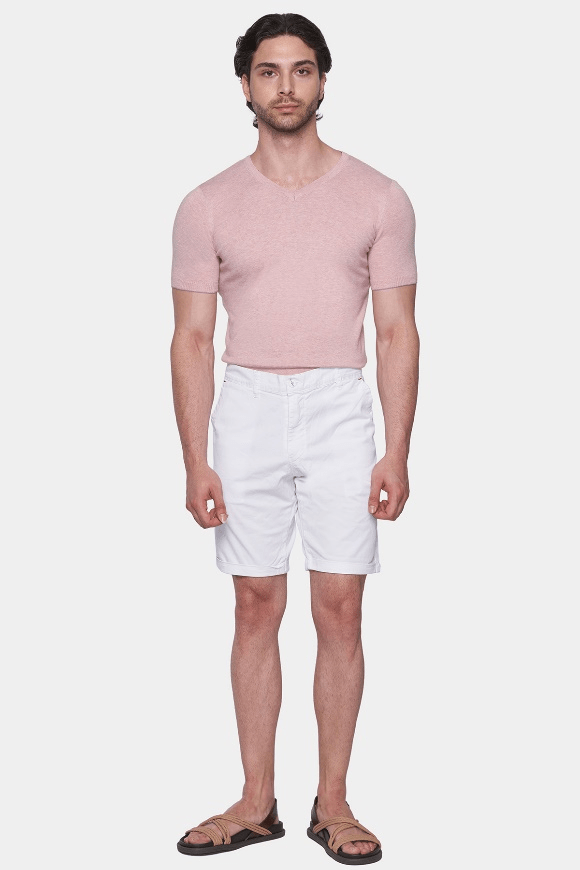 White summer shorts, mid-thigh length, front button closure.