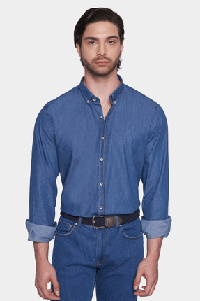 Blue denim button-up shirt with pointed collar and buttoned cuffs, front view on model