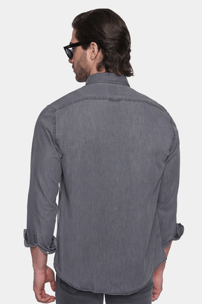 Gray denim button-up shirt shown from back with long sleeves and curved hem