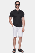 Black mercerized cotton polo with quarter-zip placket and striped trim, short sleeves.