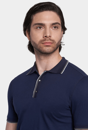 Navy mercerized cotton polo with ribbed collar and striped half-zip placket