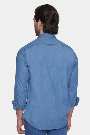 Light blue denim button-up shirt back view with yoke and buttoned cuffs