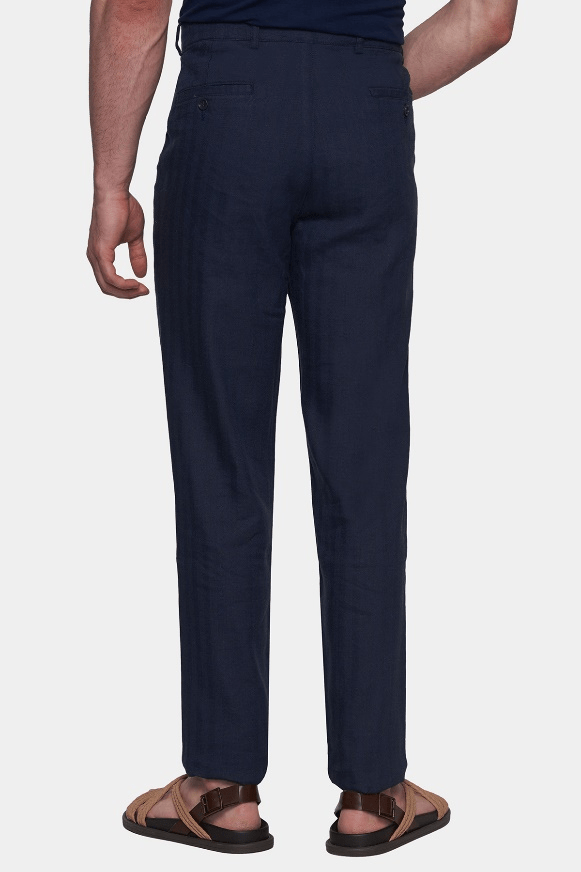 Men's dark navy chino pants, side view with ankle-length tapered fit