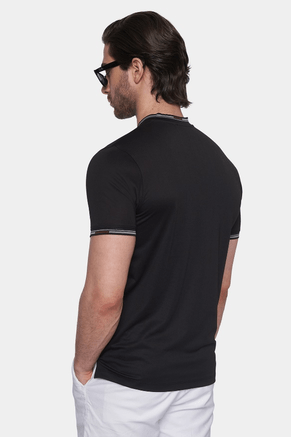Black polo shirt with short sleeves and striped trim at collar, back view.
