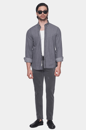 Gray denim button-up shirt with open front and rolled sleeves over a tee