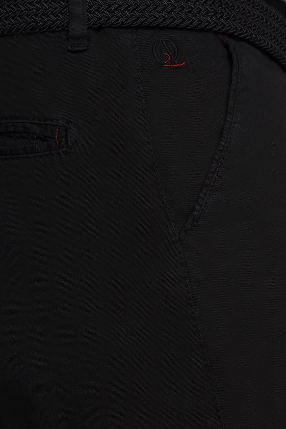 Jet black shorts close-up showing embroidered logo and stitched front pocket