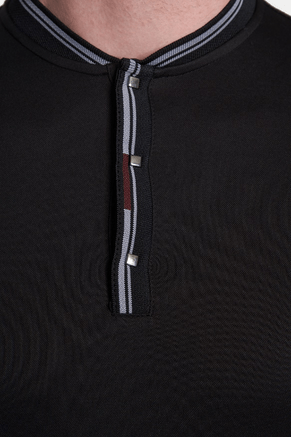 Black polo quarter-zip placket with striped tape and metal slider.