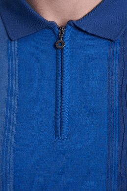 Blue polo placket close-up with small button and ribbed knit collar