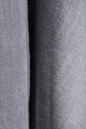 Gray denim fabric close-up showing fine textured weave