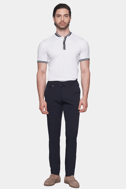 Men's white knit polo with ribbed collar, striped cuffs, and button placket