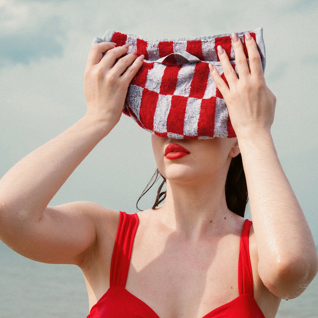 Cotton face towel with red-and-white checkered pattern