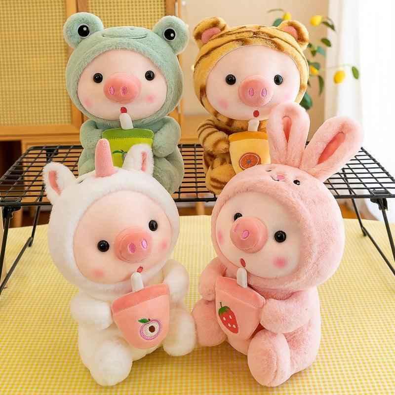 Pig boba plush toy in pastel animal hood with bubble tea cup, smiling face