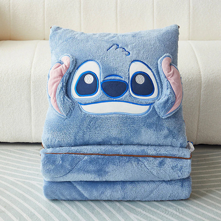 Blue plush blanket with stitched Stitch-style character face pillow design