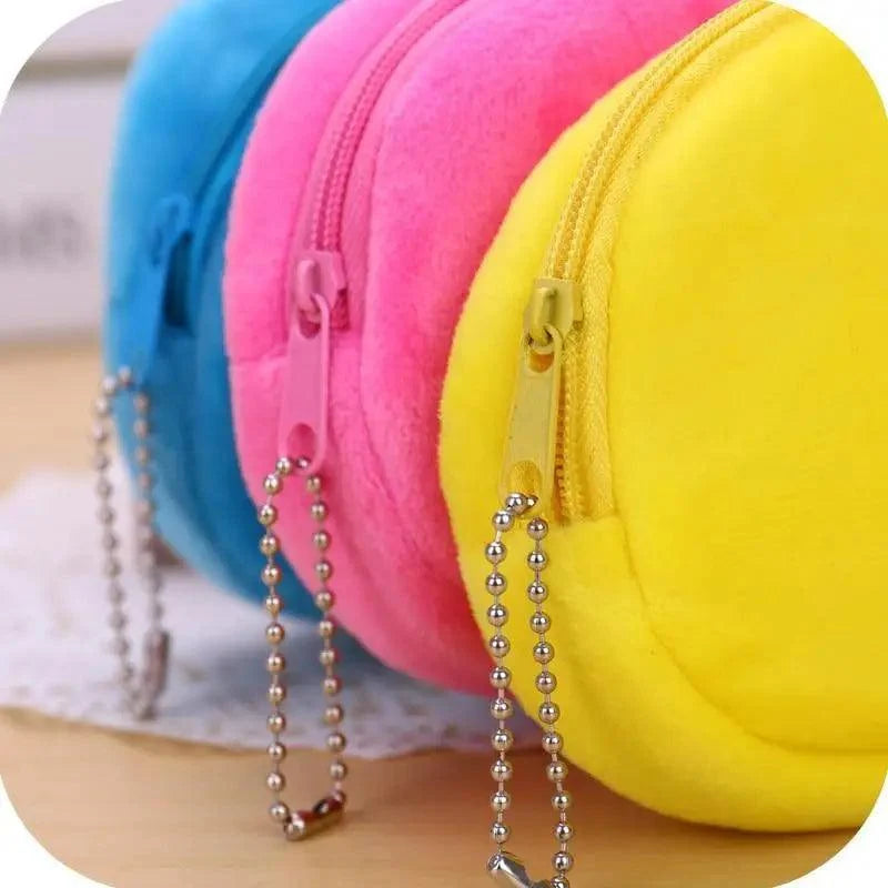 Colorful plush pencil case zipper with bead chain and blue, pink, and yellow fabric.