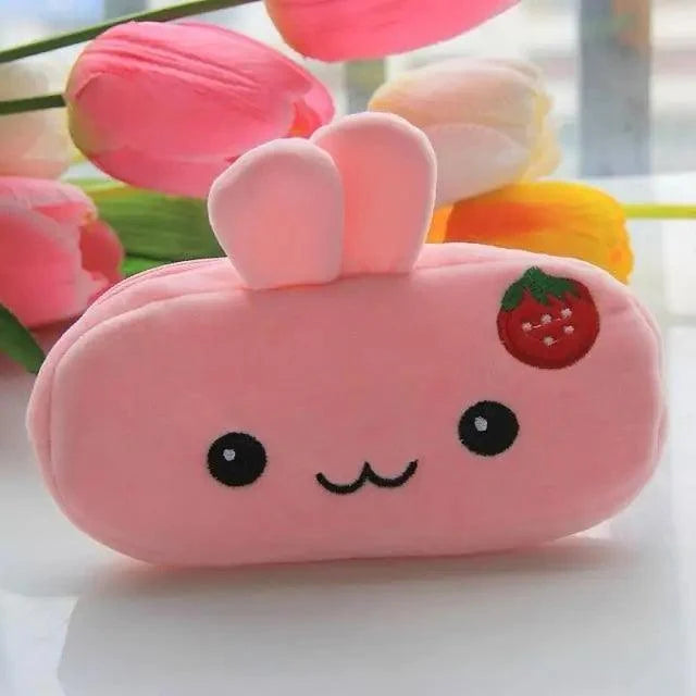 Pink plush bunny pencil case with strawberry patch and heart-shaped ears.