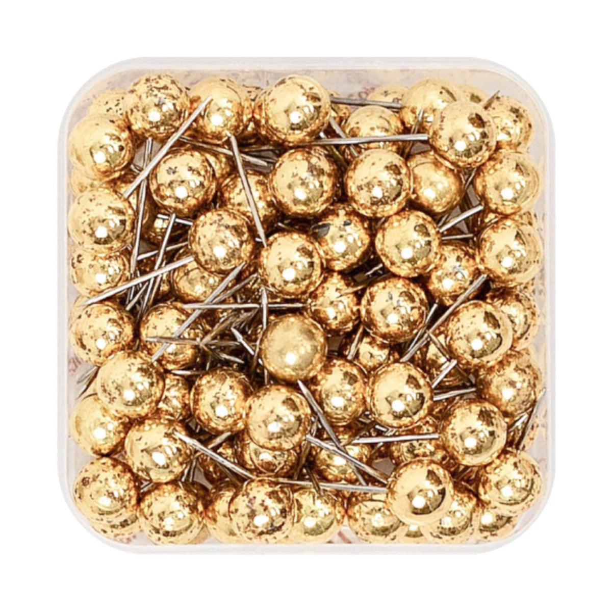 Gold canvas push pins with silver needle points in a clear storage box