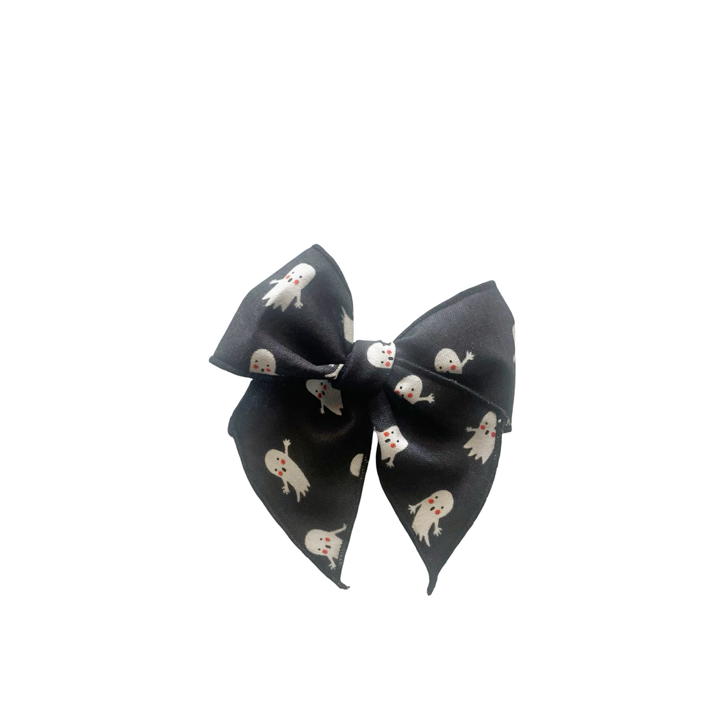 Small ghost print hair bow with tied center and pointed ends
