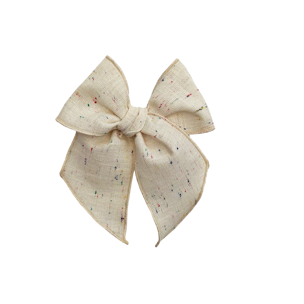 Cream linen hair bow with multicolor confetti speckles and pointed tails