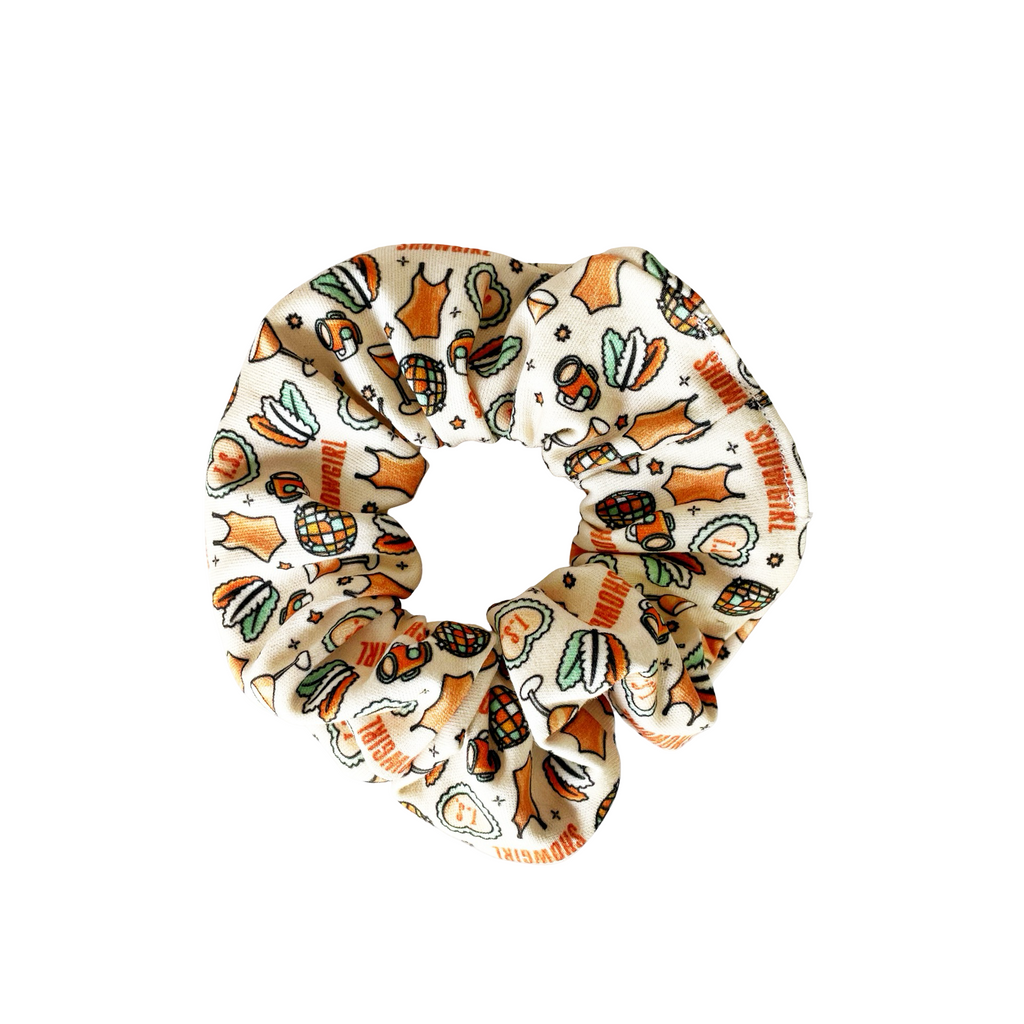 Cream printed scrunchie with orange and green cartoon motifs