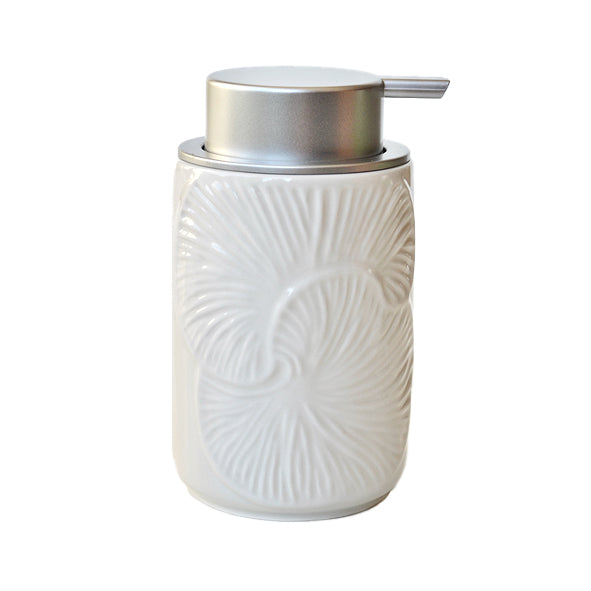 White ceramic foaming soap dispenser with silver pump and embossed leaf-like pattern
