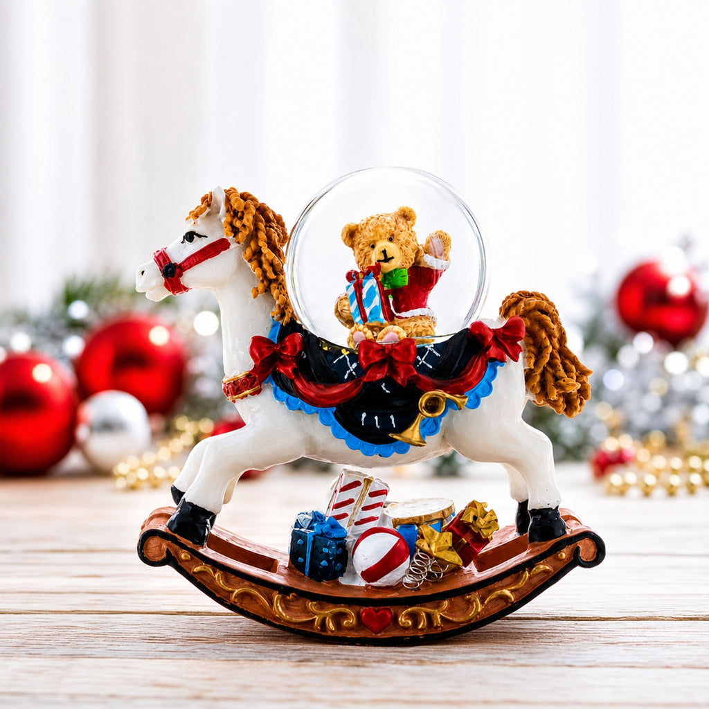 Christmas rocking horse snow globe featuring a teddy bear in a red outfit