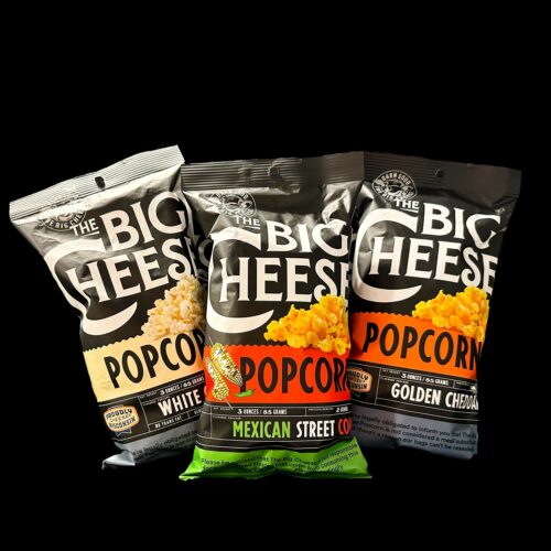 Big Cheese popcorn bags on display; white cheddar bag shown