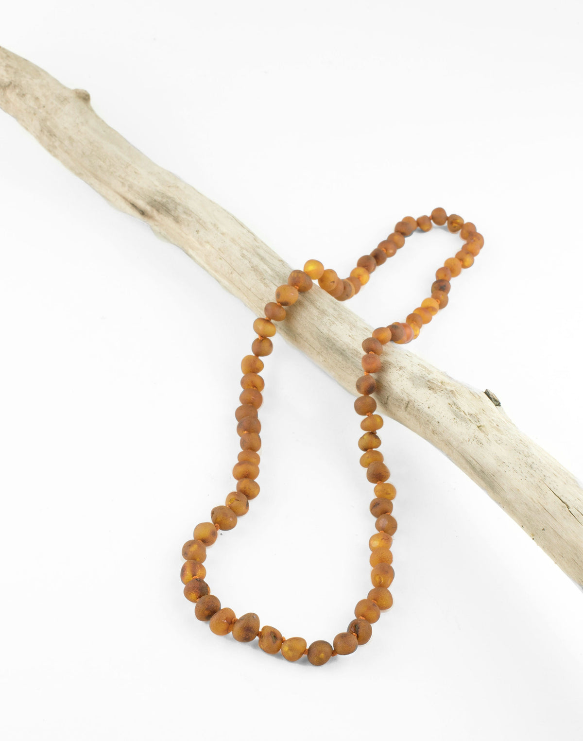 Raw amber bead necklace with honey-cognac round beads, long looped strands
