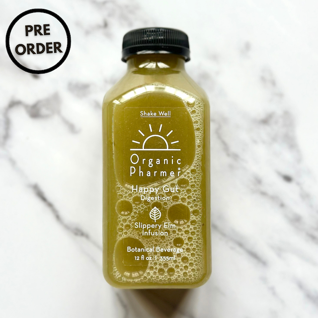 Amber-gold botanical drink bottle with black cap; front label with Happy Gut text