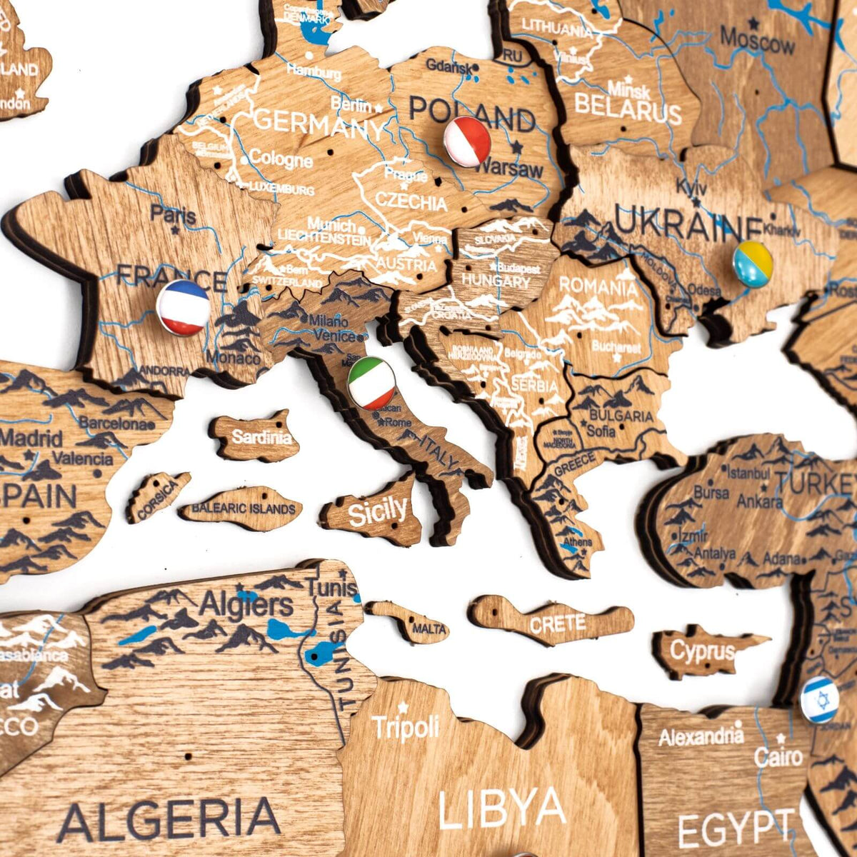 Wooden world map wall decor with interlocking puzzle-style pieces, labeled by countries