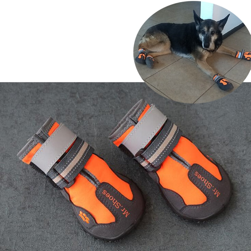 Orange and black waterproof dog boots with gray hook-and-loop straps and paw logo