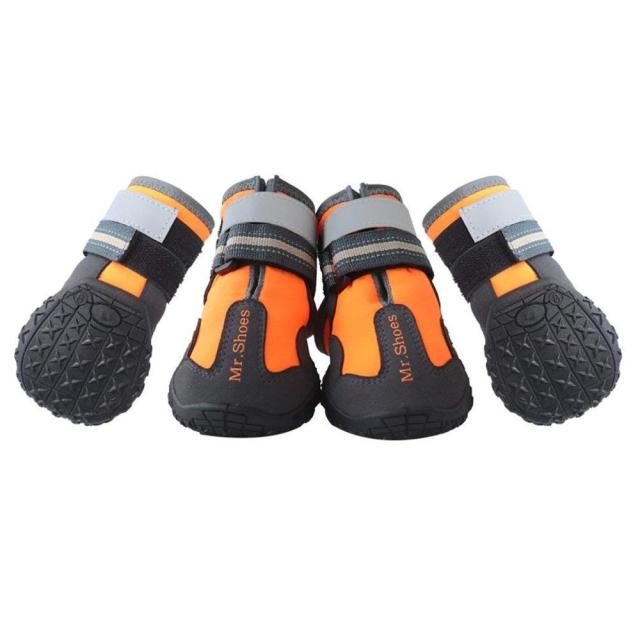 Four-pack of orange and black waterproof dog boots with gray strap details
