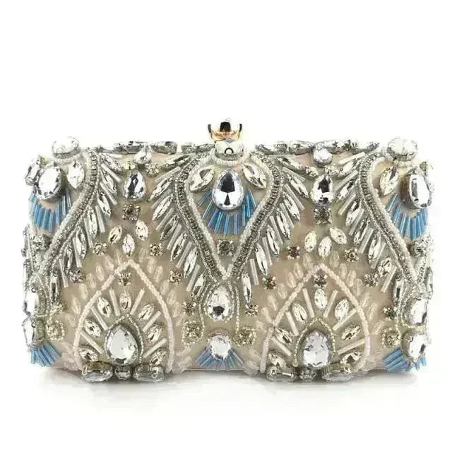 Champagne-silver rhinestone minaudiere clutch with ornate fan pattern and gold clasp