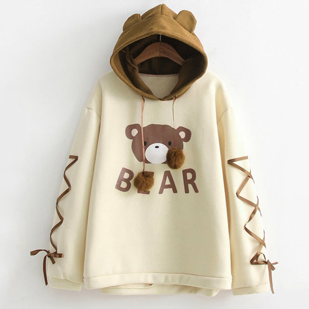 Women's light yellow bear graphic pullover hoodie with brown bear hood and ribbon sleeve ties