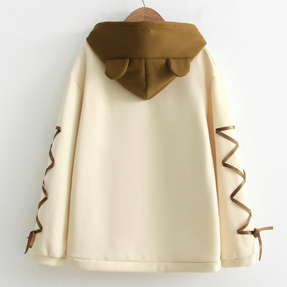 Women's light yellow hoodie, back view, brown bear-shaped hood and ribbon sleeve ties