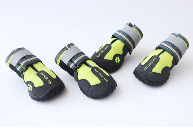 Set of neon green waterproof dog shoes with black soles and hook-and-loop straps