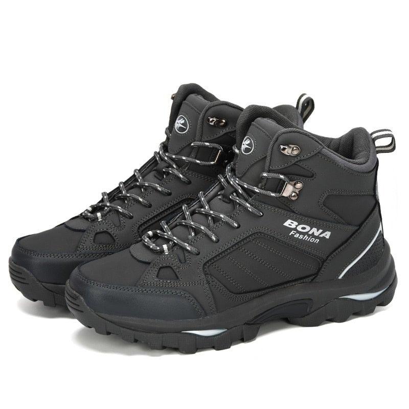 Pair of men's black lace-up hiking boots with padded collar and thick tread